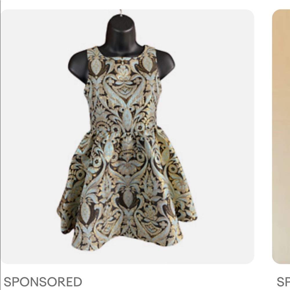 Brand-new with the tech girls dress size 12 brocade fabric with black lining.